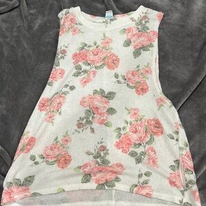 Sleeveless white top with roses size small